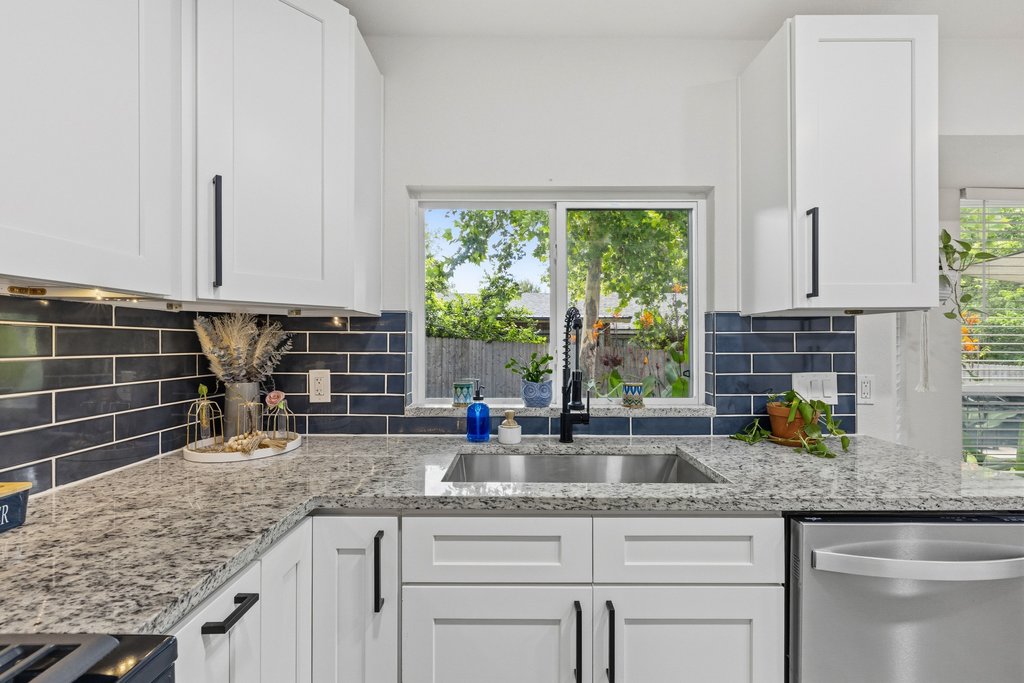 4805 Spring Meadow Cove Austin, TX 78744 - Photo 7 of 26 Light & bright kitchen with ample counter space and a view of backyard