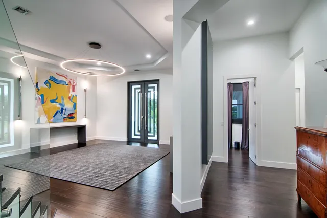 a kitchen with stainless steel appliances a sink and a refrigerator
