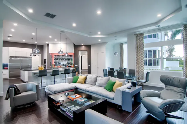 a spacious bedroom with a bed and a flat screen tv