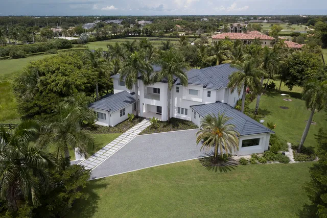 an aerial view of a house with a garden