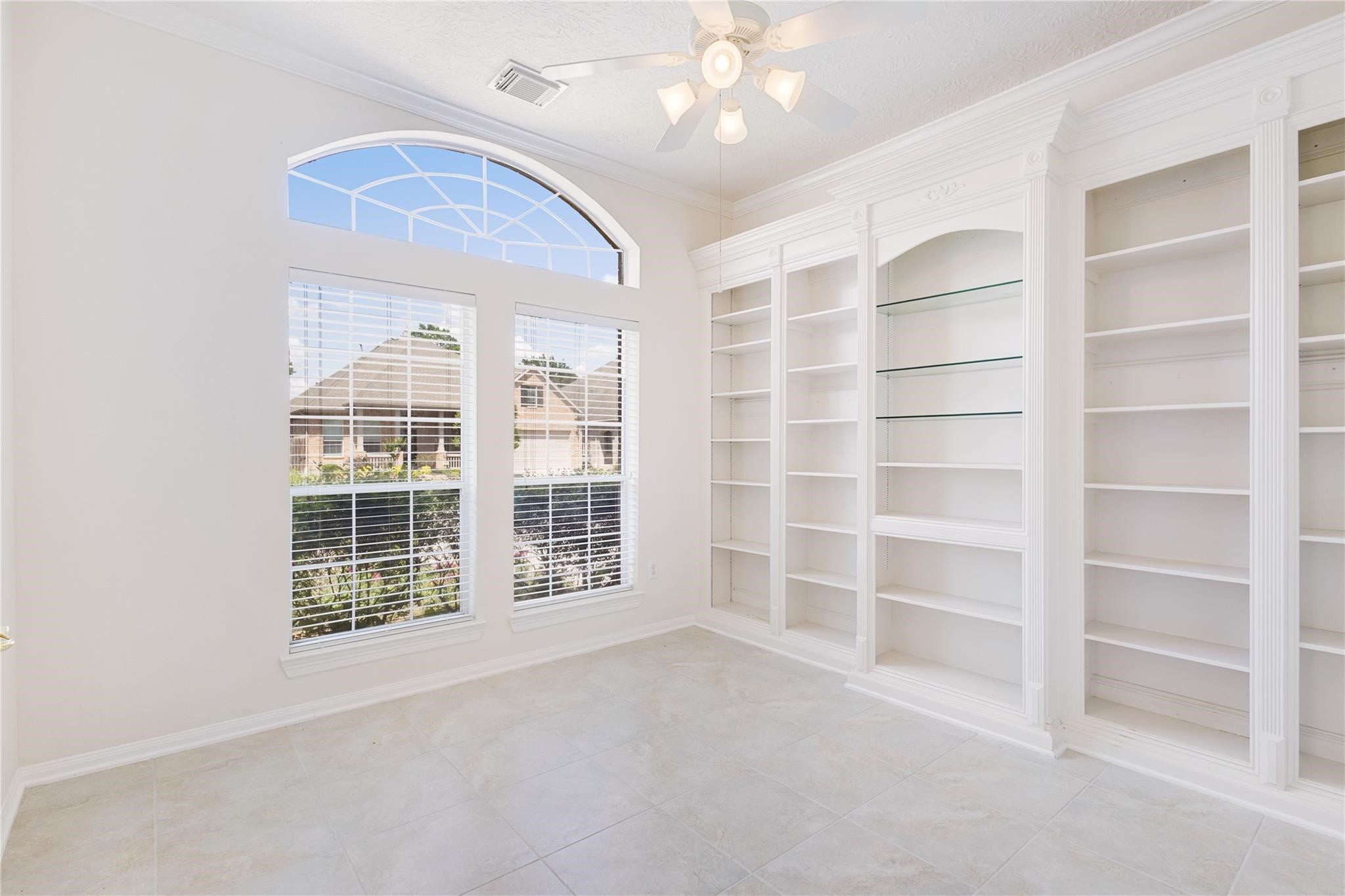 43 Tarrytown Way Conroe, TX 77384 - Photo 12 of 40 a view of an empty room with a window and cabinet
