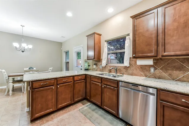a kitchen with a sink counter top space and cabinets