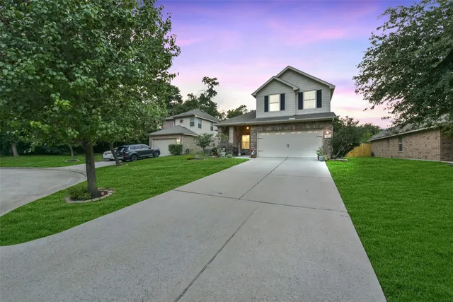 a front view of a house with yard