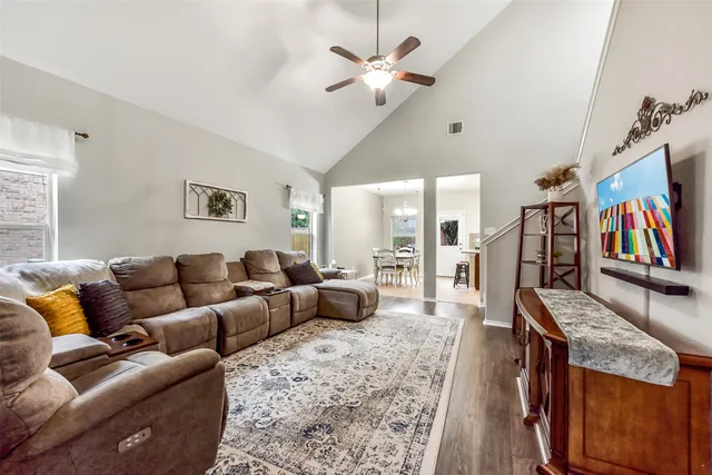 a living room with furniture fireplace and a flat screen tv