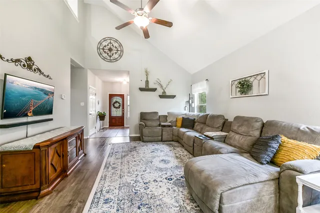 a living room with furniture and a flat screen tv