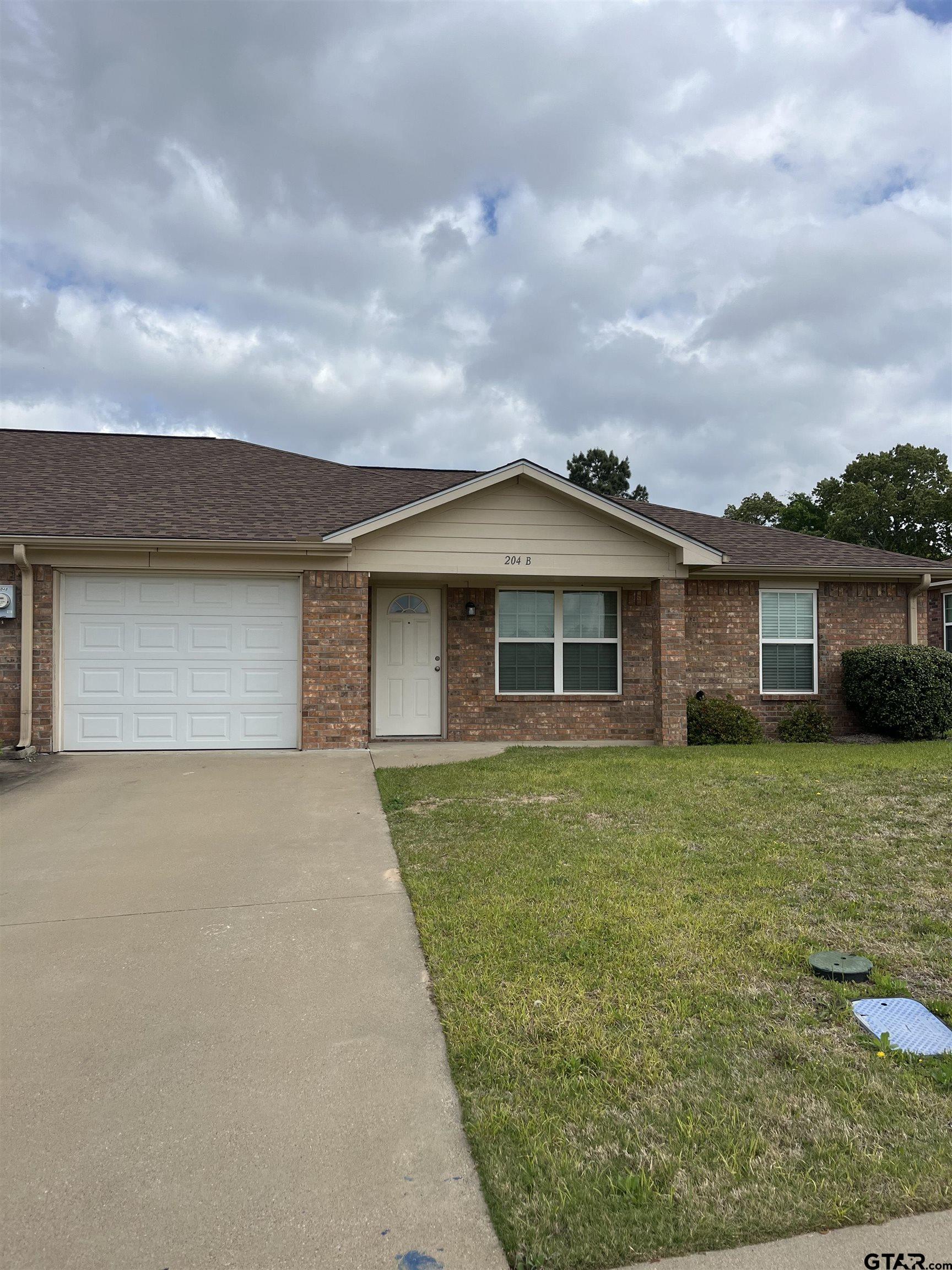 204 B Timber Park Lindale, TX 75771 - Photo 1 of 1 front view of a house with a yard