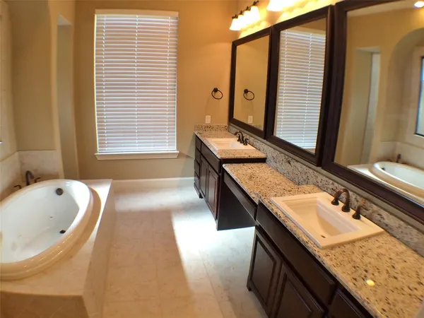 a bathroom with a tub and shower