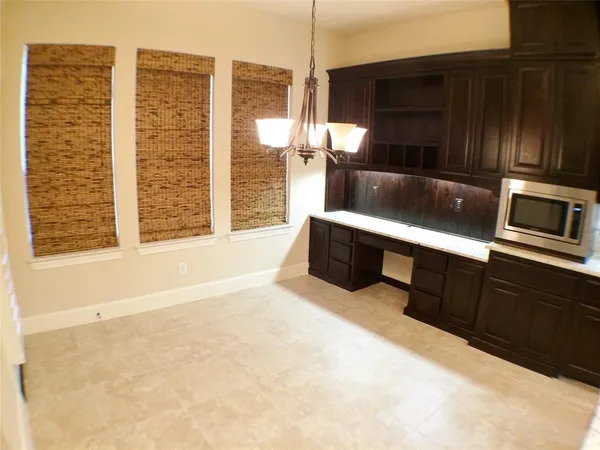 a view of a house with a garden and plants