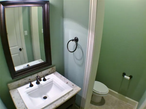a bathroom with a sink and cabinets