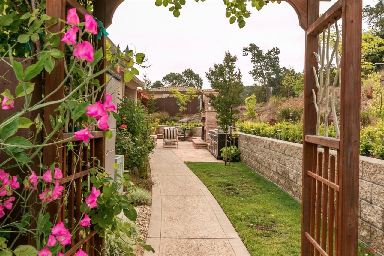 6300 San Gabriel Road Atascadero, CA 93422 - Photo 23 of 25 a picture of flowers outside the house and wooden floor