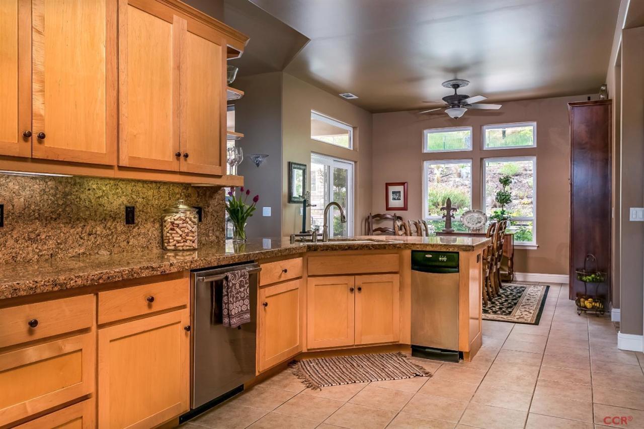 6300 San Gabriel Road Atascadero, CA 93422 - Photo 9 of 25 a kitchen with stainless steel appliances granite countertop a sink and cabinets