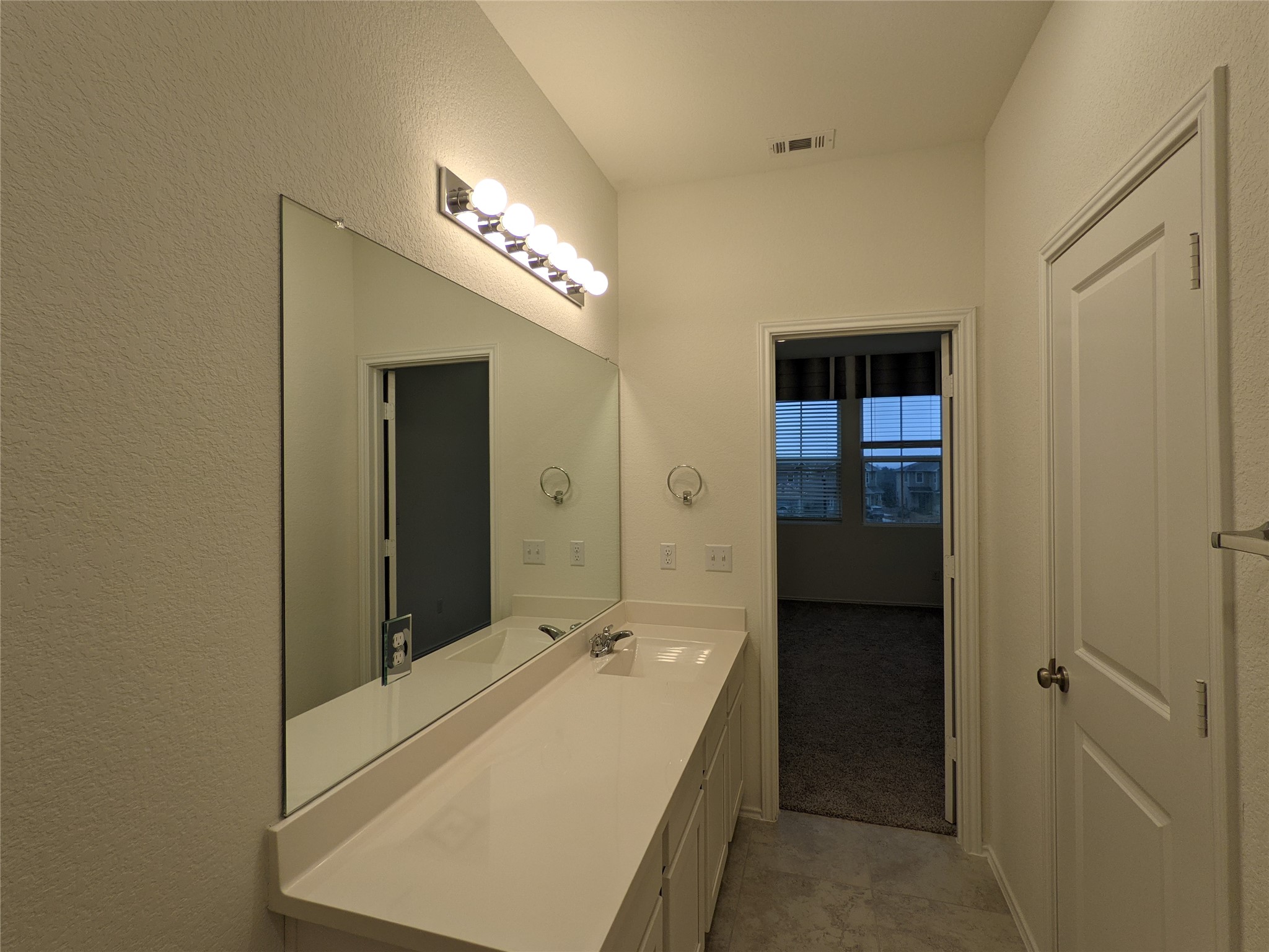 100 Montauk Loop Georgetown, TX 78628 - Photo 17 of 21 A well-appointed bathroom vanity with ample counter space and a wide mirror.