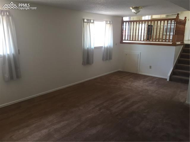 2441 Ranch Lane Colorado Springs, CO 80918 - Photo 13 of 24 Lower Family Room