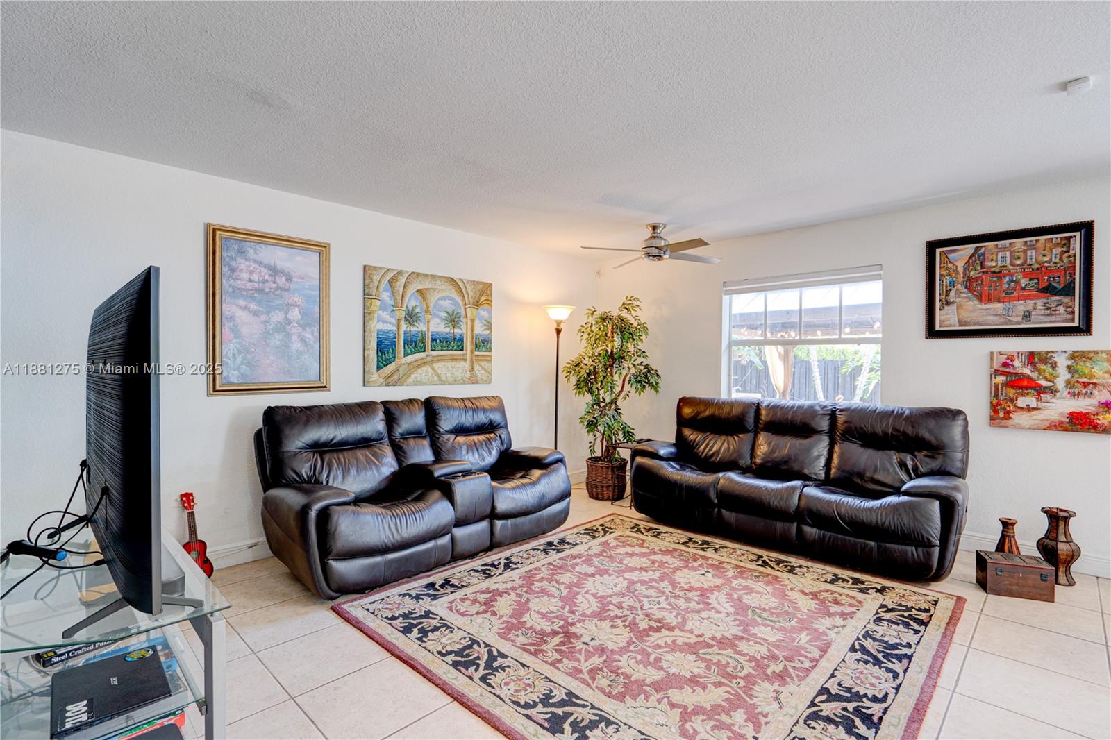 15750 Southwest 45th Street Miami, FL 33185 - Photo 11 of 45 a living room with furniture and a rug