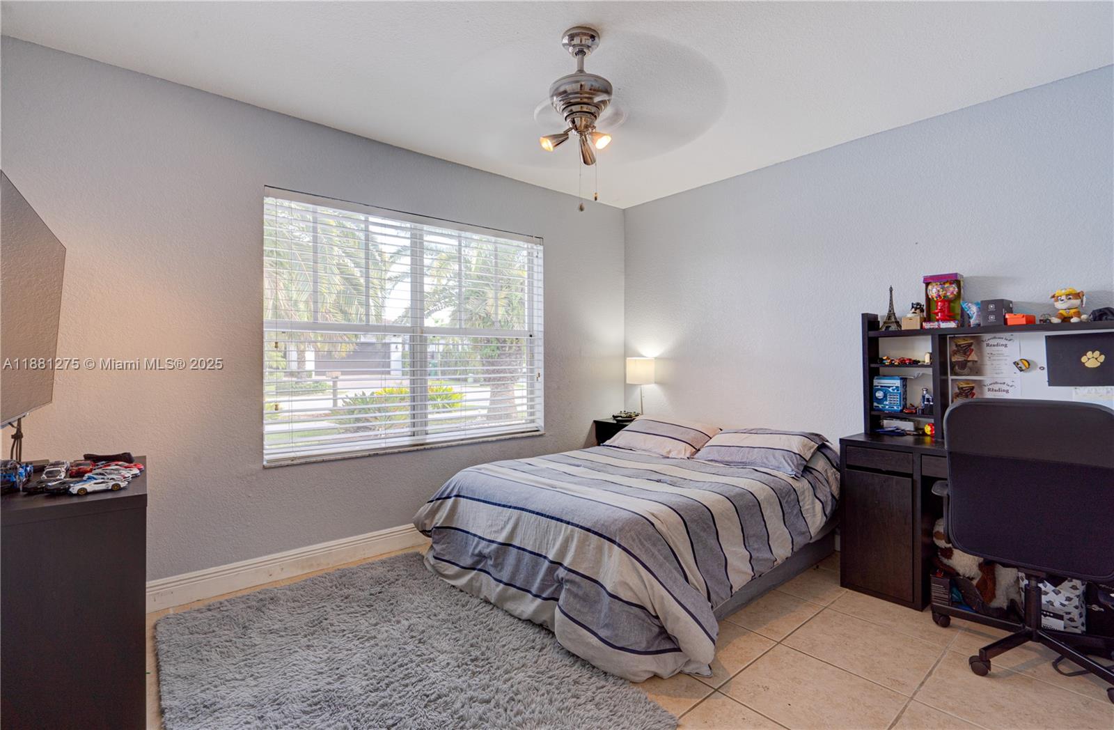 15750 Southwest 45th Street Miami, FL 33185 - Photo 19 of 45 a bedroom with a bed and a window