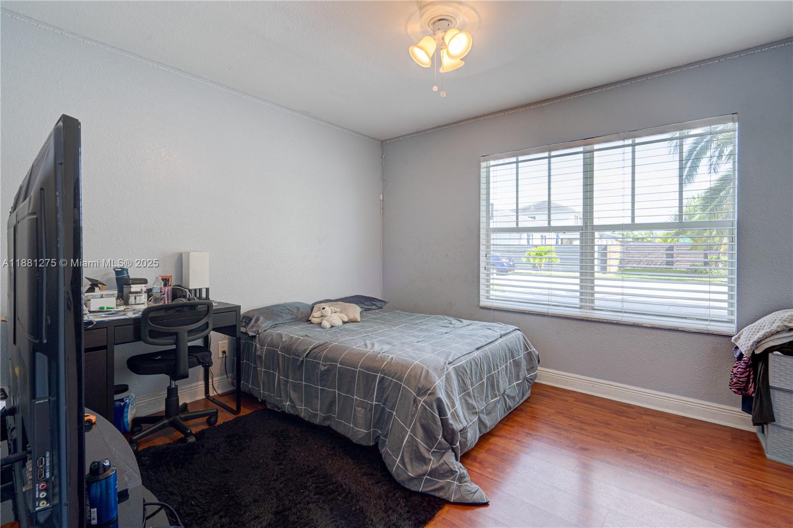 15750 Southwest 45th Street Miami, FL 33185 - Photo 21 of 45 a bedroom with a bed and a window