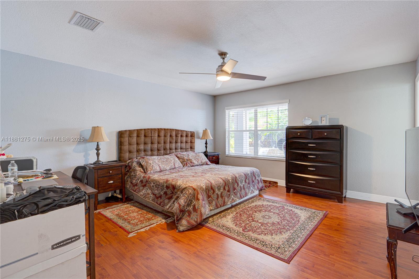 15750 Southwest 45th Street Miami, FL 33185 - Photo 26 of 45 a bedroom with a bed and a dresser