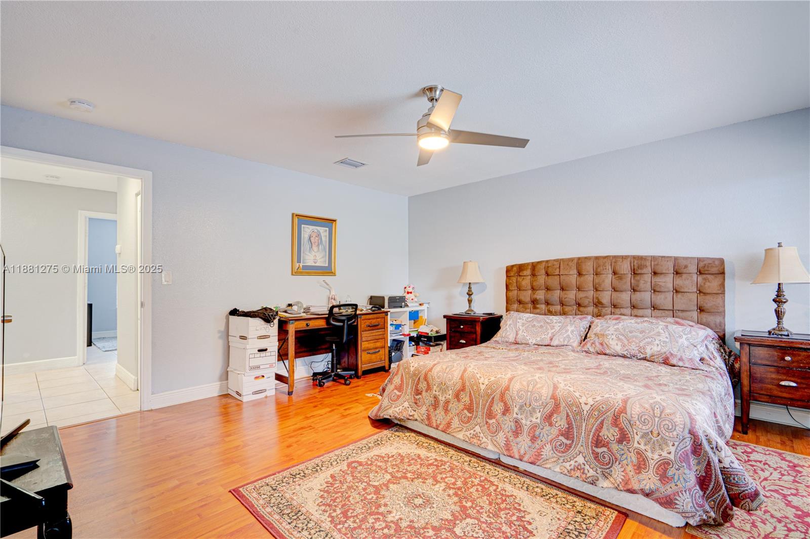 15750 Southwest 45th Street Miami, FL 33185 - Photo 27 of 45 a bedroom with a bed and wooden floor