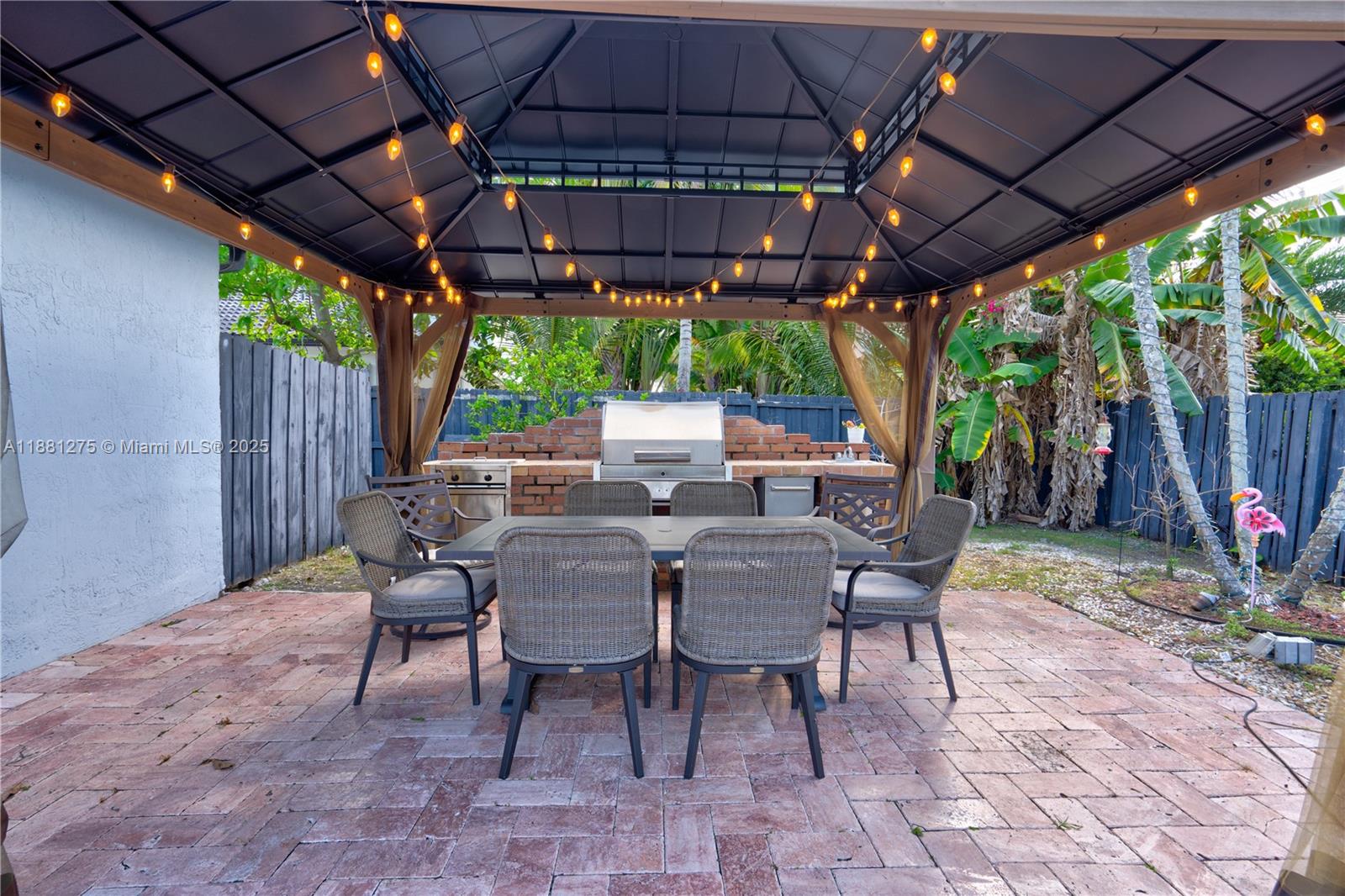 15750 Southwest 45th Street Miami, FL 33185 - Photo 36 of 45 a view of a table and chairs in patio