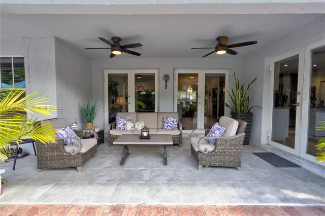 a view of a chairs and table under an umbrella