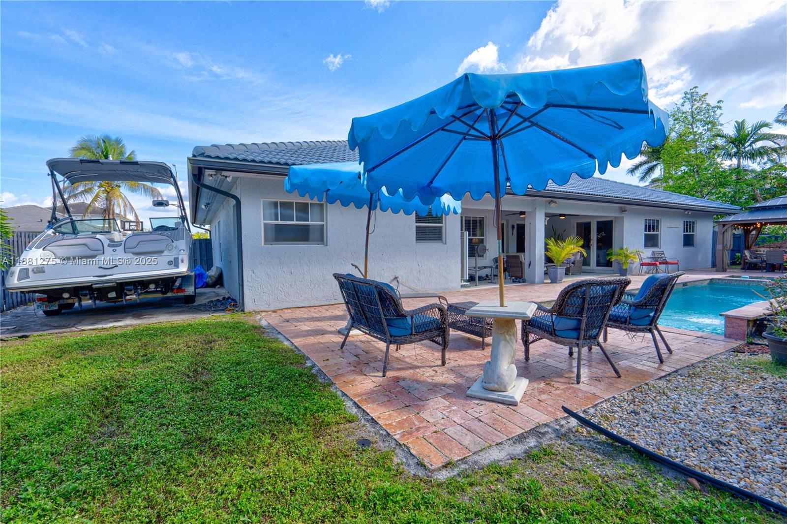 15750 Southwest 45th Street Miami, FL 33185 - Photo 40 of 45 a view of a house with backyard and sitting area