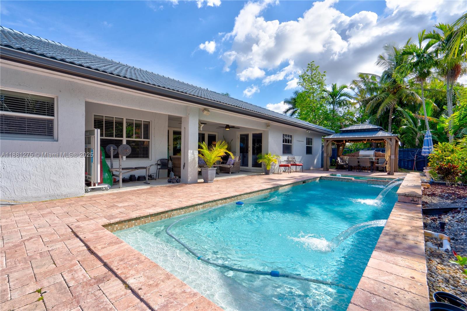 15750 Southwest 45th Street Miami, FL 33185 - Photo 41 of 45 a view of a house with swimming pool and furniture