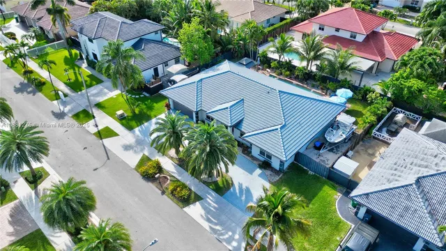 an aerial view of house with yard