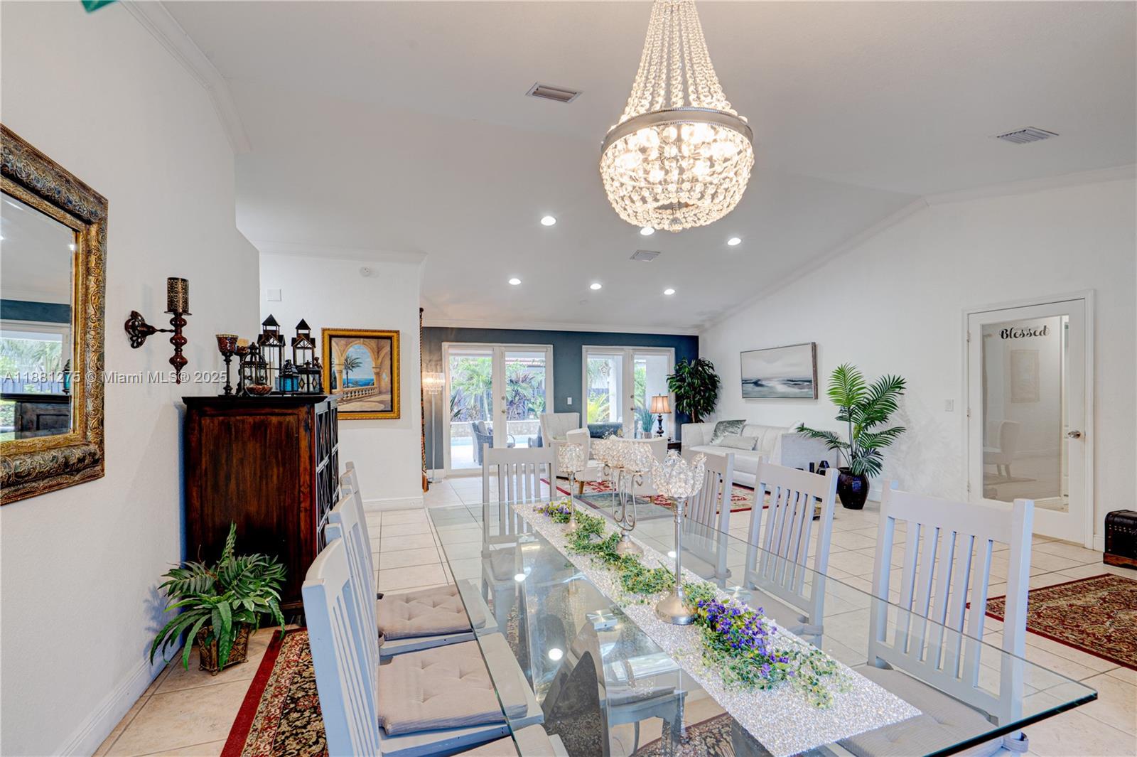 15750 Southwest 45th Street Miami, FL 33185 - Photo 9 of 45 a view of a dining room with furniture wooden floor and chandelier