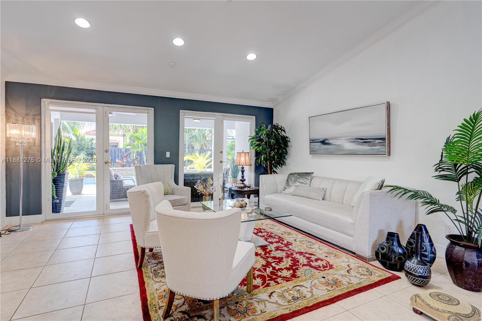 15750 Southwest 45th Street Miami, FL 33185 - Photo 10 of 45 a living room with furniture and a large window