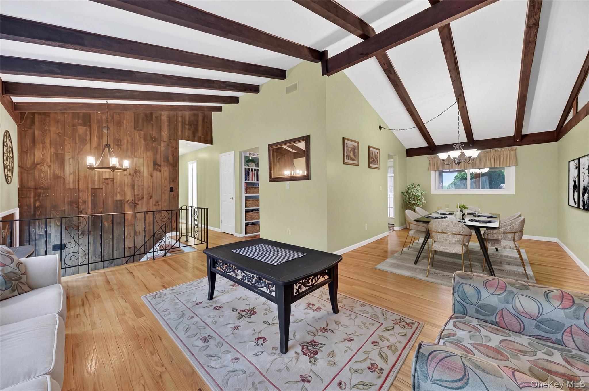 1 Rockledge Road Poughkeepsie, NY 12601 - Photo 6 of 36 Vaulted ceilings with exposed wood beams, hardwood flooring, open to formal dining room