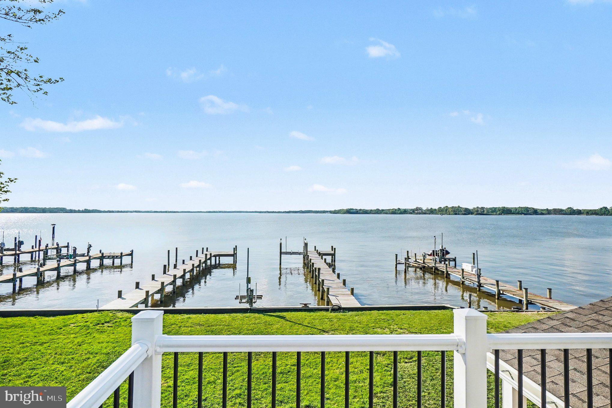9108 Hinton Avenue Sparrows Point, MD 21219 - Photo 57 of 86 a balcony with outdoor seating and lake view