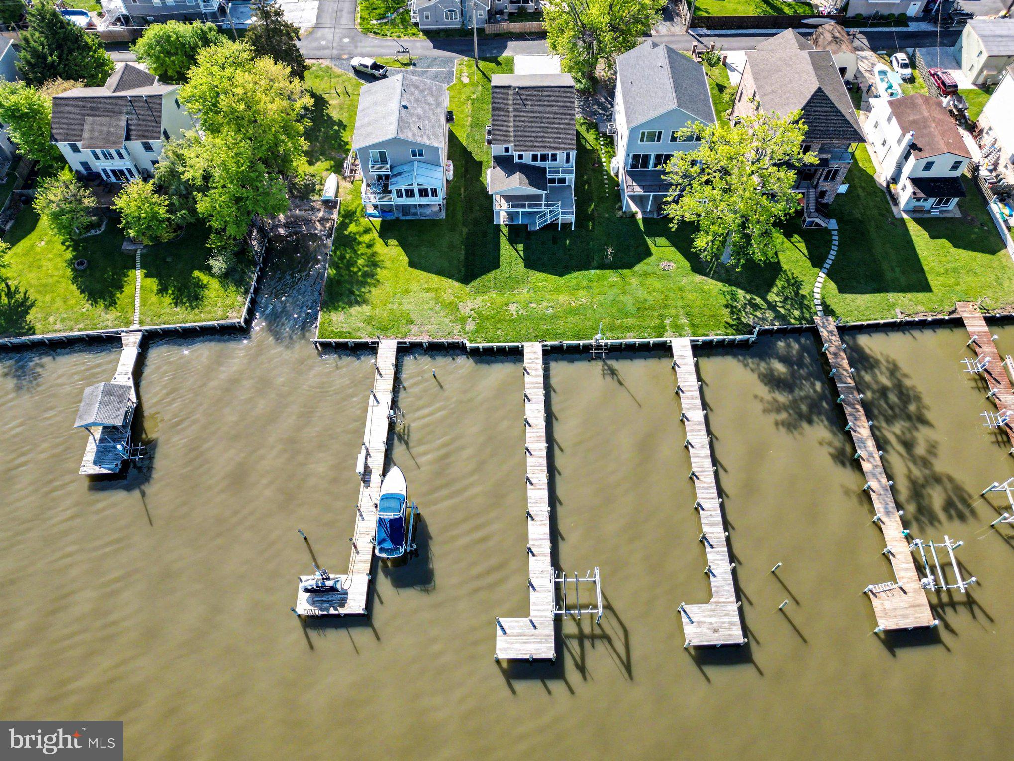 9108 Hinton Avenue Sparrows Point, MD 21219 - Photo 83 of 86 an aerial view of a house with a yard and lake view