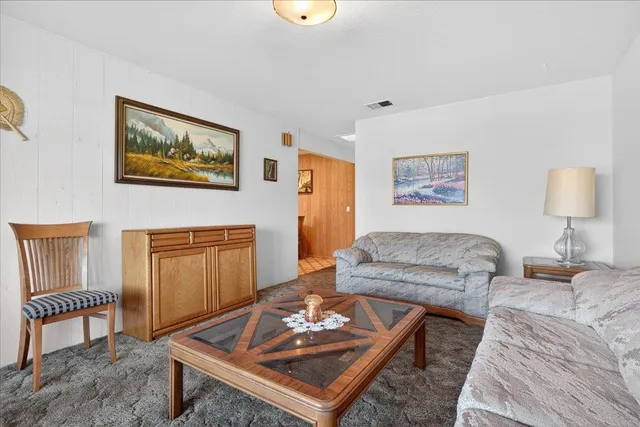 a living room with furniture and a table