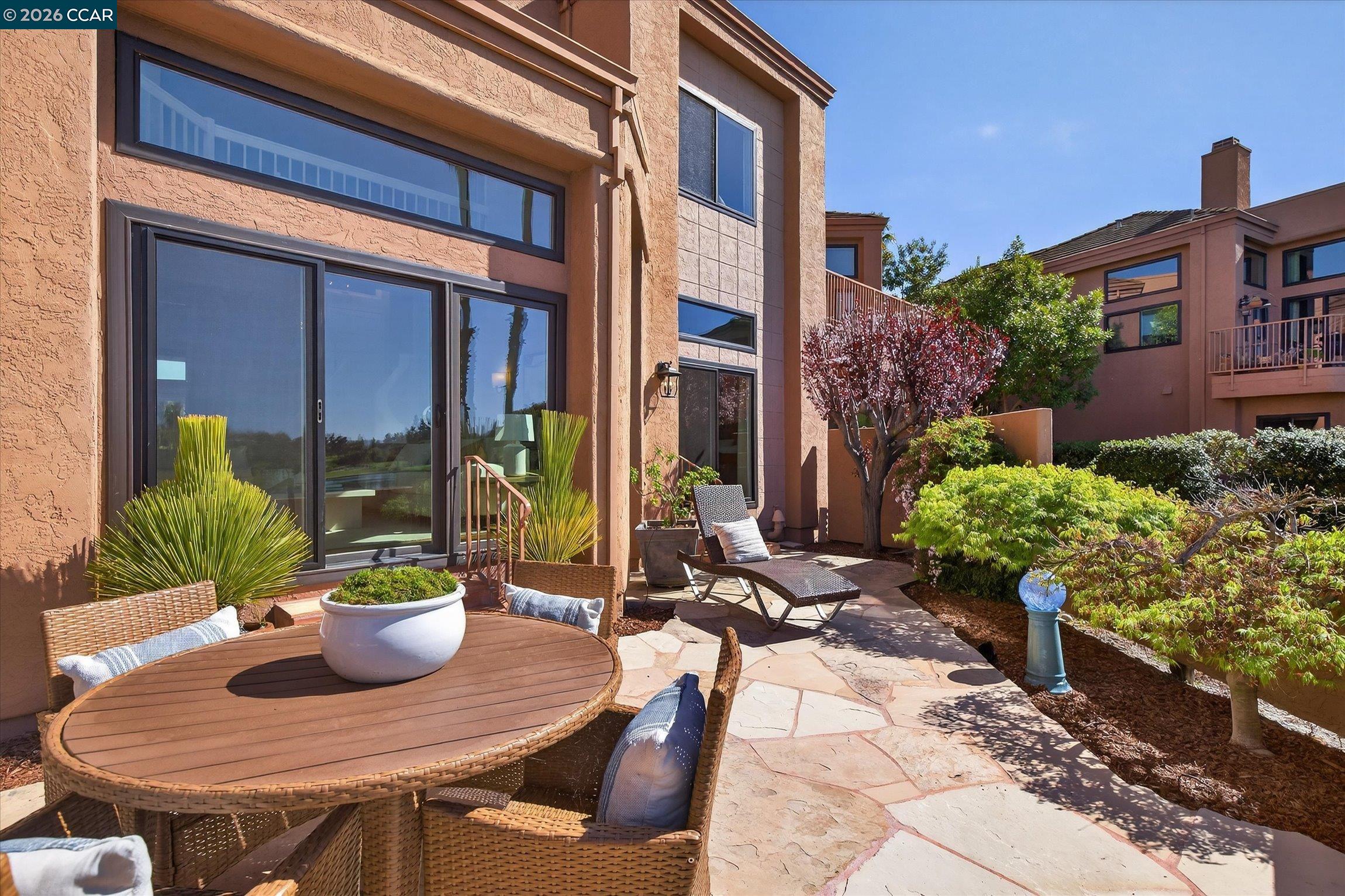 4059 West Lakeshore Drive San Ramon, CA 94582 - Photo 16 of 45 a view of a patio with table and chairs potted plants