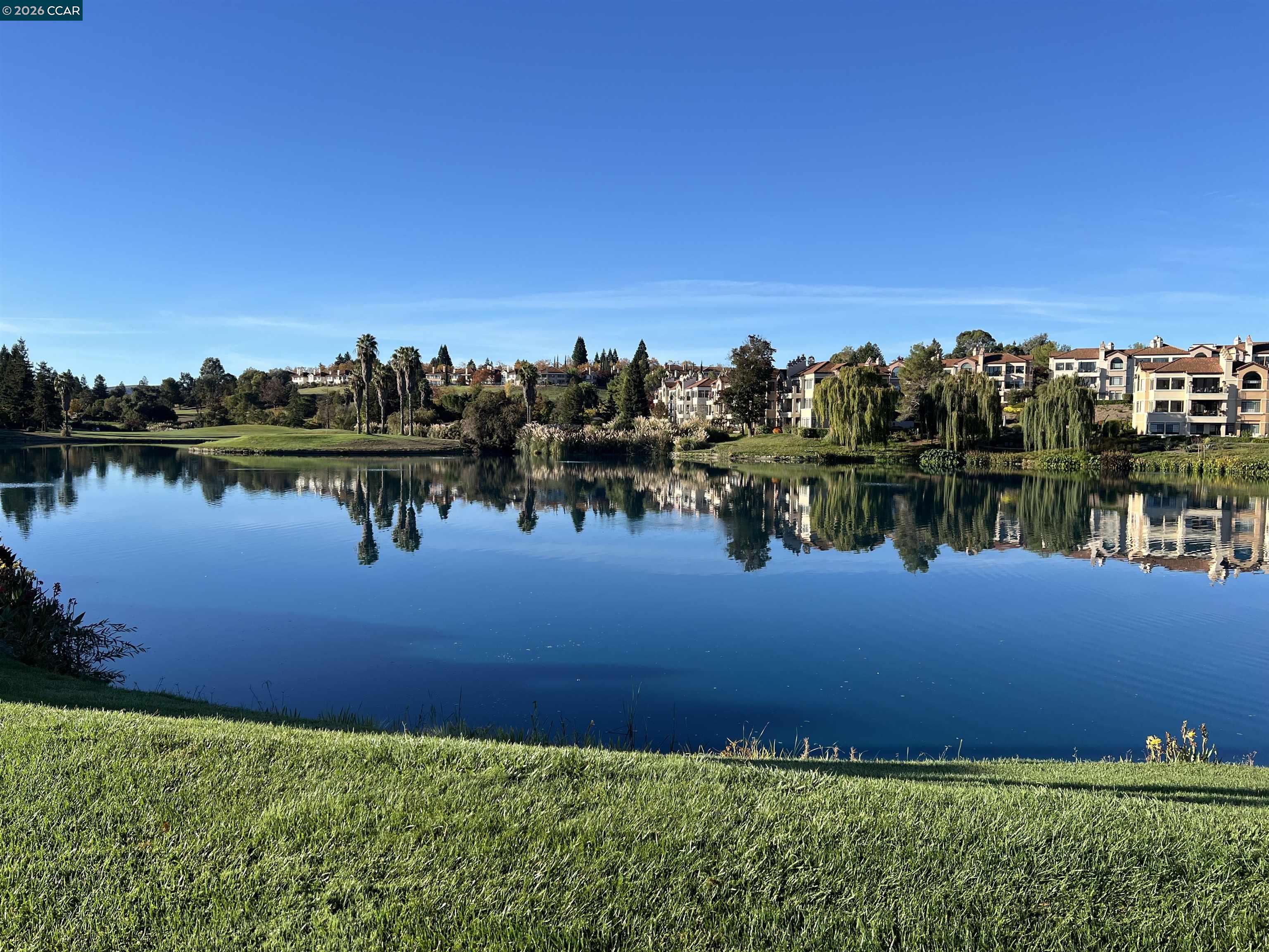 4059 West Lakeshore Drive San Ramon, CA 94582 - Photo 2 of 45 a view of a lake with houses in the back