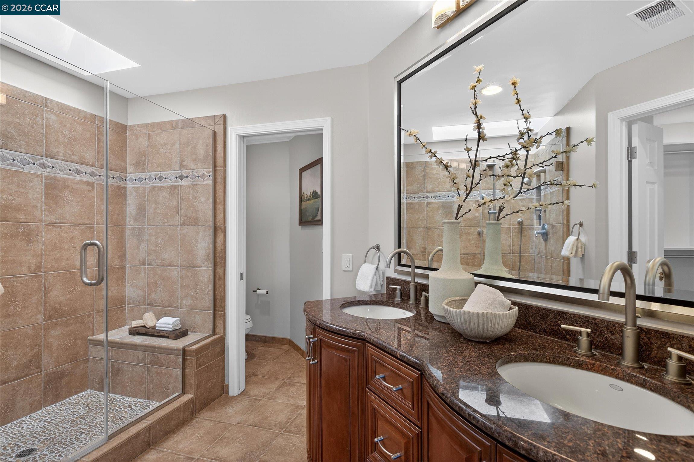 4059 West Lakeshore Drive San Ramon, CA 94582 - Photo 28 of 45 a bathroom with double vanity and a shower