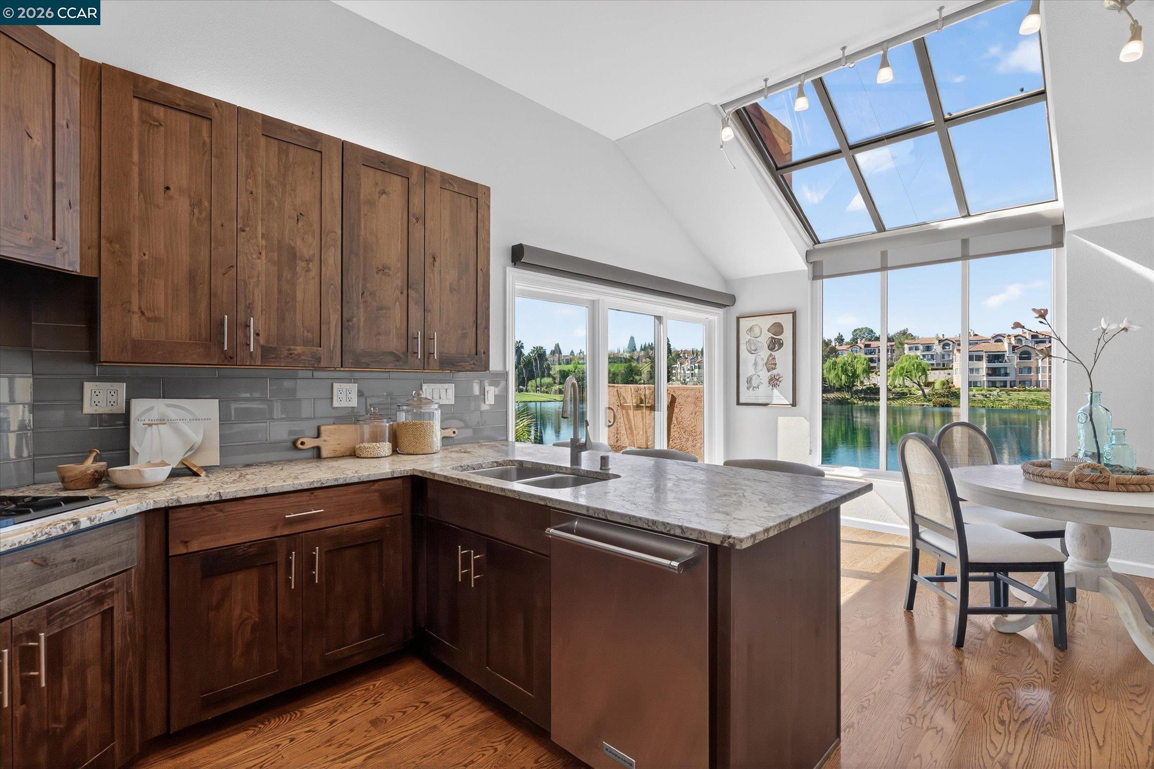 4059 West Lakeshore Drive San Ramon, CA 94582 - Photo 10 of 45 a kitchen with a sink a window and chairs