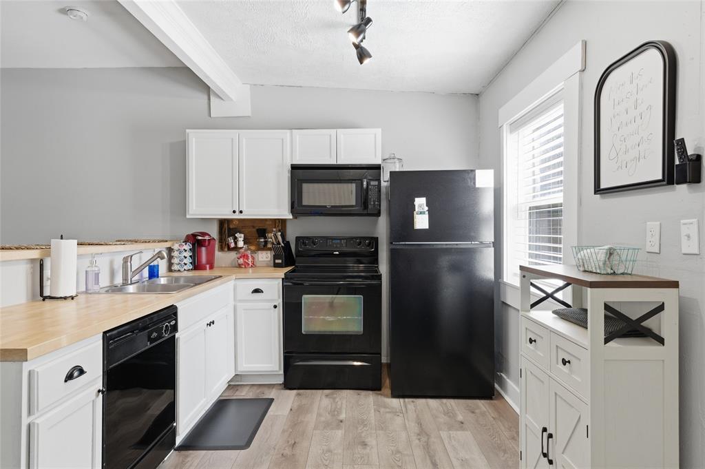 2320 Mistletoe Street Waco, TX 76706 - Photo 3 of 23 a kitchen with stainless steel appliances granite countertop a refrigerator sink and stove