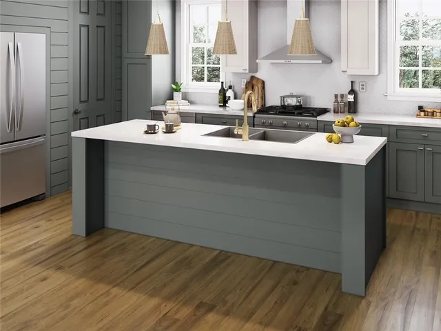 a kitchen with a sink cabinets and a wooden floor