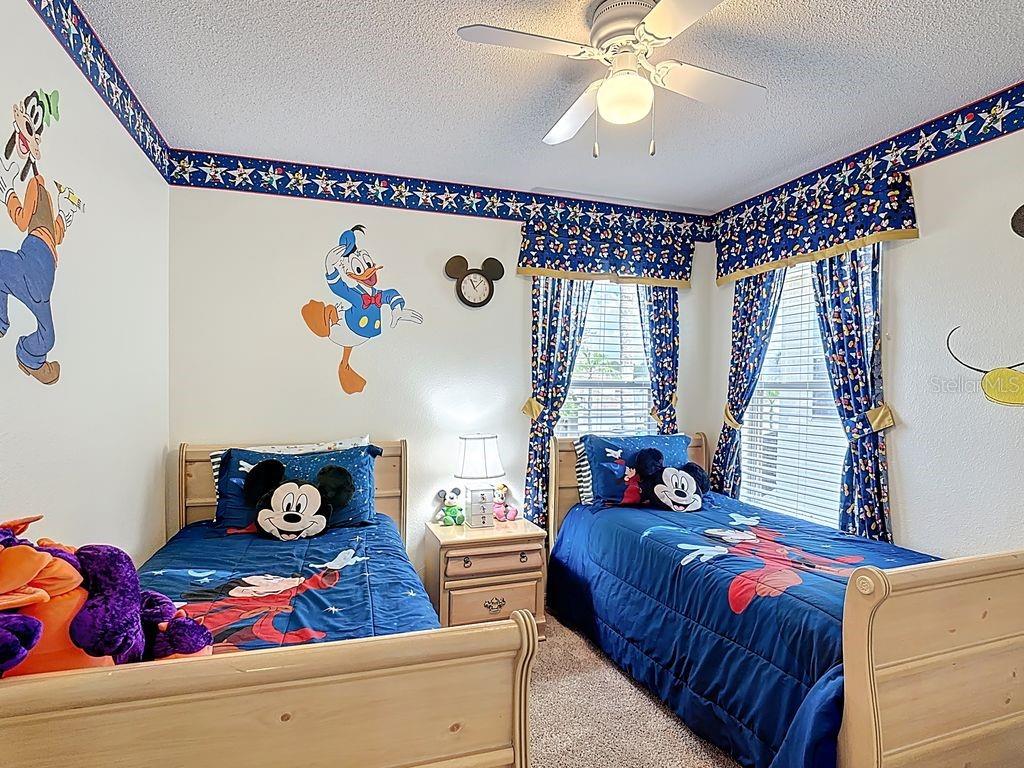 955 Lake Berkley Drive Kissimmee, FL 34746 - Photo 28 of 57 a bedroom with bed and a window