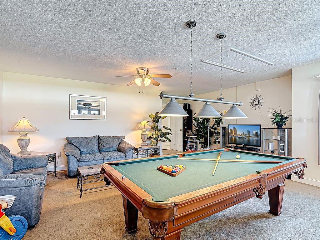 955 Lake Berkley Drive Kissimmee, FL 34746 - Photo 32 of 57 a room with pool table and a ceiling fan
