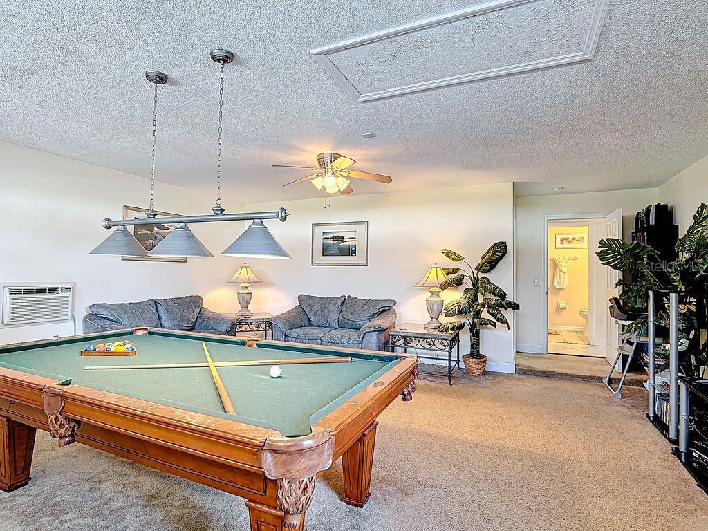 955 Lake Berkley Drive Kissimmee, FL 34746 - Photo 34 of 57 a room with table tennis air hockey table and arcade game machine