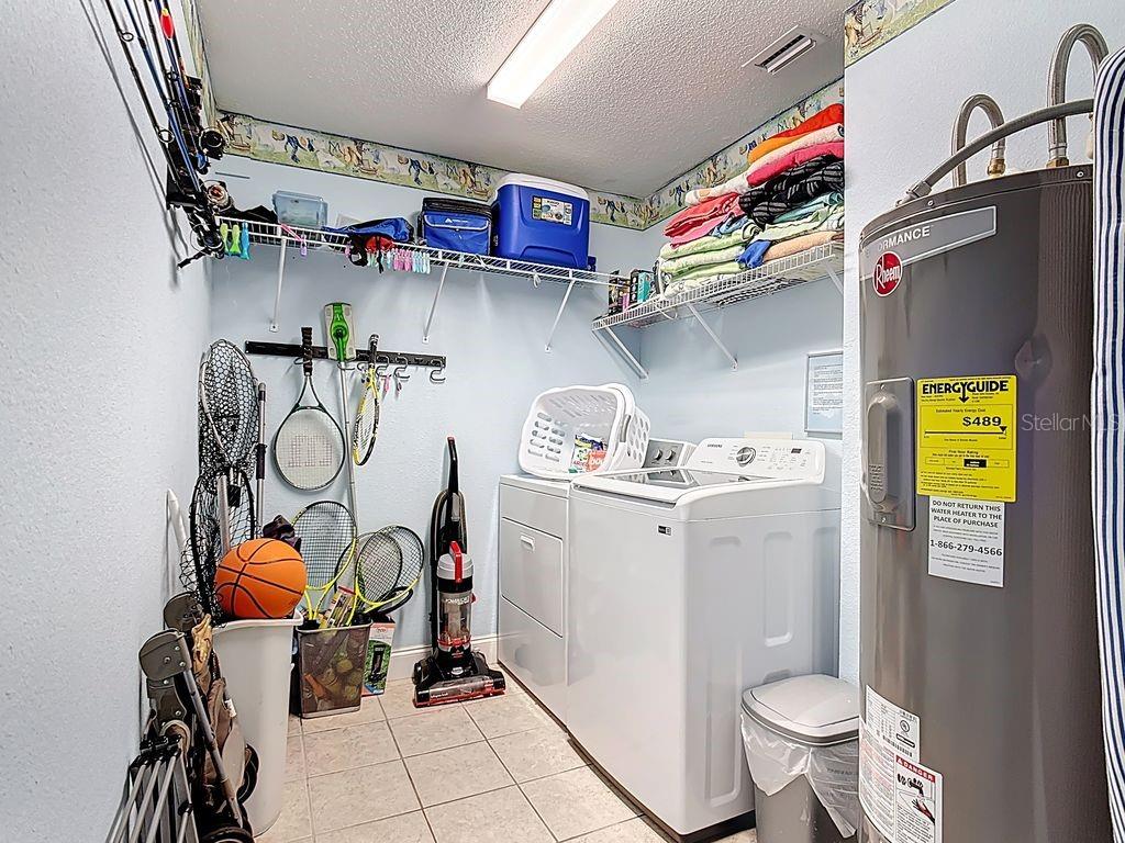 955 Lake Berkley Drive Kissimmee, FL 34746 - Photo 36 of 57 a utility room with dryer washer and other items
