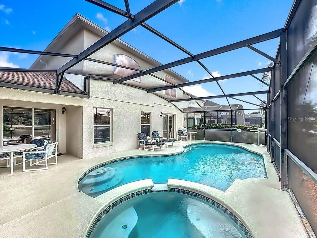 955 Lake Berkley Drive Kissimmee, FL 34746 - Photo 40 of 57 a view of a swimming pool with a patio