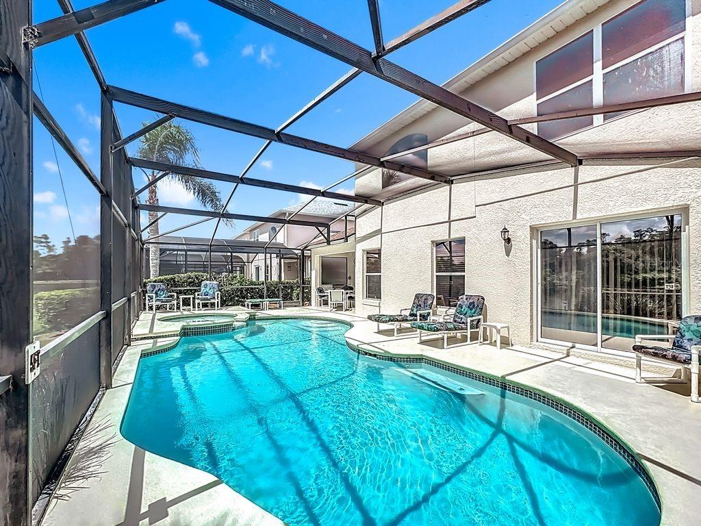 955 Lake Berkley Drive Kissimmee, FL 34746 - Photo 41 of 57 a view of swimming pool with outdoor seating