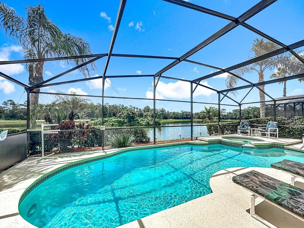 955 Lake Berkley Drive Kissimmee, FL 34746 - Photo 42 of 57 a view of a backyard with sitting area