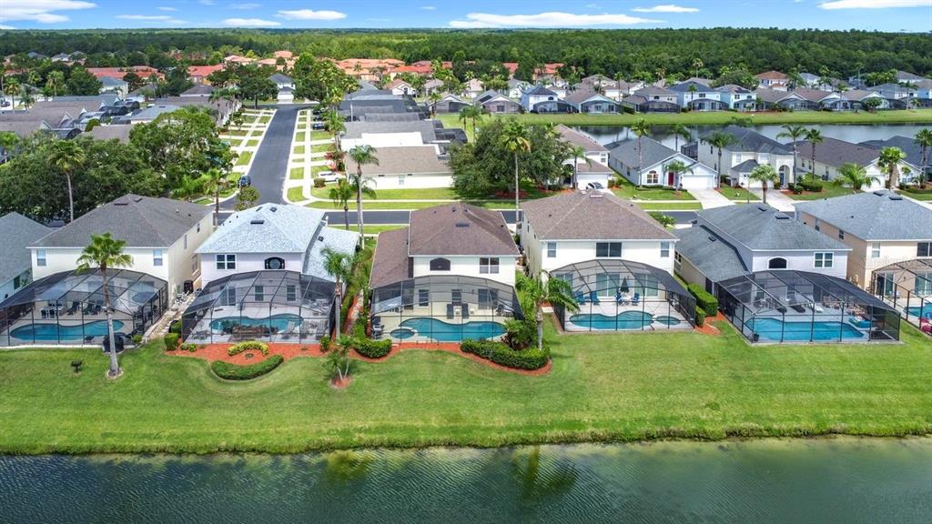 955 Lake Berkley Drive Kissimmee, FL 34746 - Photo 51 of 57 an aerial view of residential houses with outdoor space and lake view