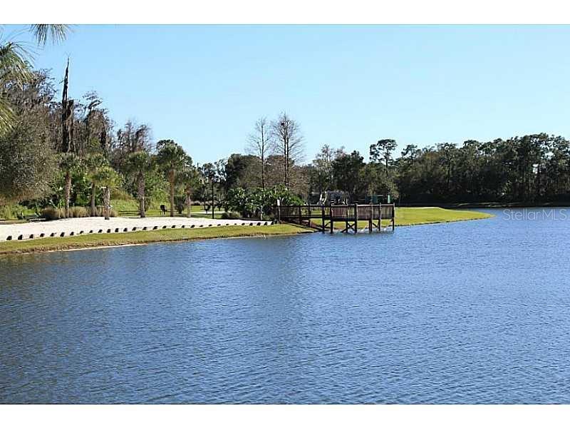 955 Lake Berkley Drive Kissimmee, FL 34746 - Photo 56 of 57 a view of a swimming pool with an outdoor space and seating area