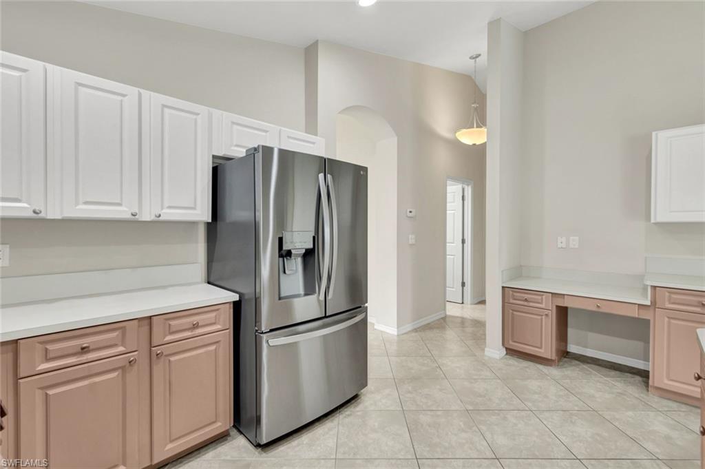 15645 Beachcomber Avenue Fort Myers, FL 33908 - Photo 12 of 33 a kitchen with stainless steel appliances granite countertop a refrigerator and a sink