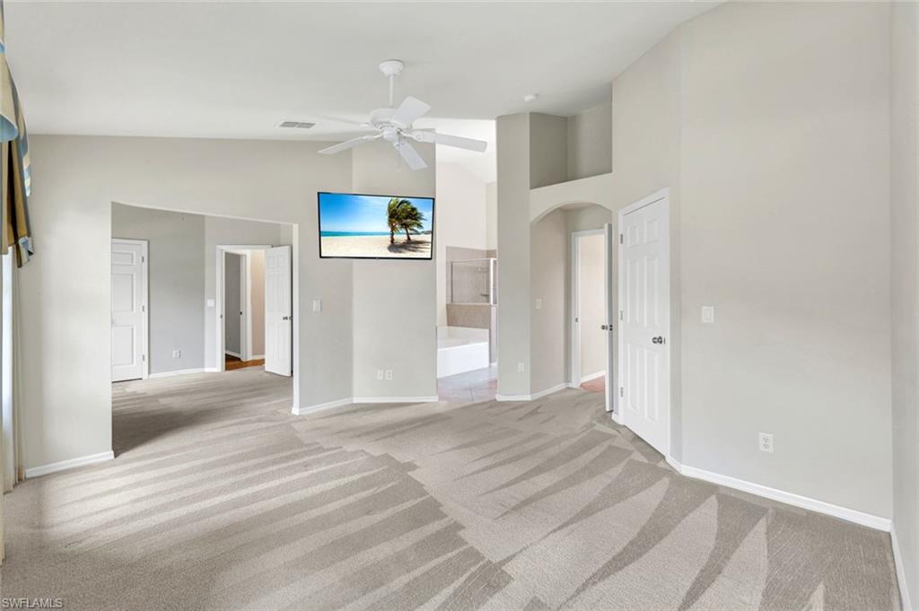 15645 Beachcomber Avenue Fort Myers, FL 33908 - Photo 16 of 33 a view of a hallway with wooden floor and cabinet